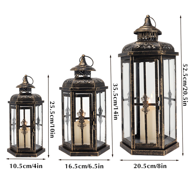 Set of 3 outdoor metal and glass candle lanterns for patio decor, featuring large decorative lanterns with handles and glass panels.