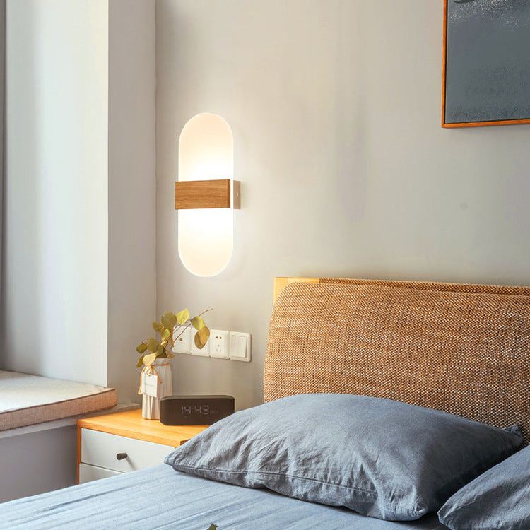 Modern wooden LED wall lamp by FLIPSTYLEZLLC, ideal for living rooms, bedrooms, and study areas, providing soft ambient lighting.