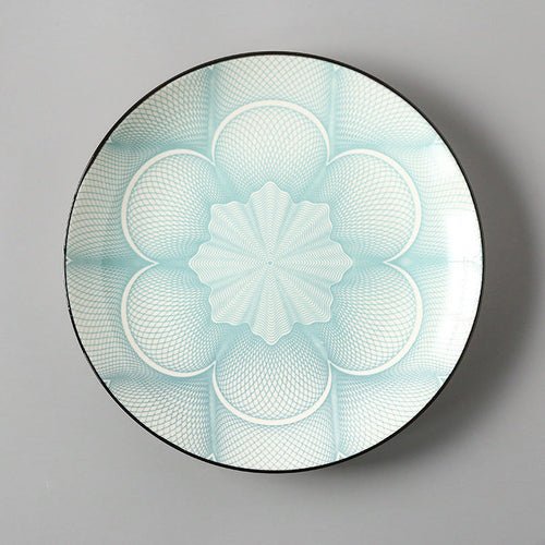 Decorative plate with geometric floral design on a gray background
