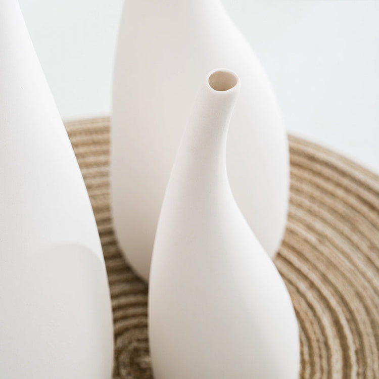 White ceramic water drop vase with dried flowers, modern design by FLIPSTYLEZLLC, perfect for stylish room decor.