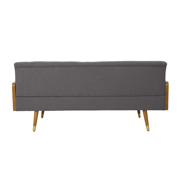A grey fabric Aidan mid-century modern tufted sofa with sleek design and plush cushions on a contemporary living room floor.