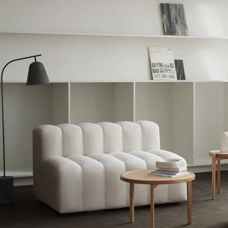 Off-white modern curved sofa by FLIPSTYLEZLLC, Lamb Velvet sectional couch with sleek design and plush upholstery.