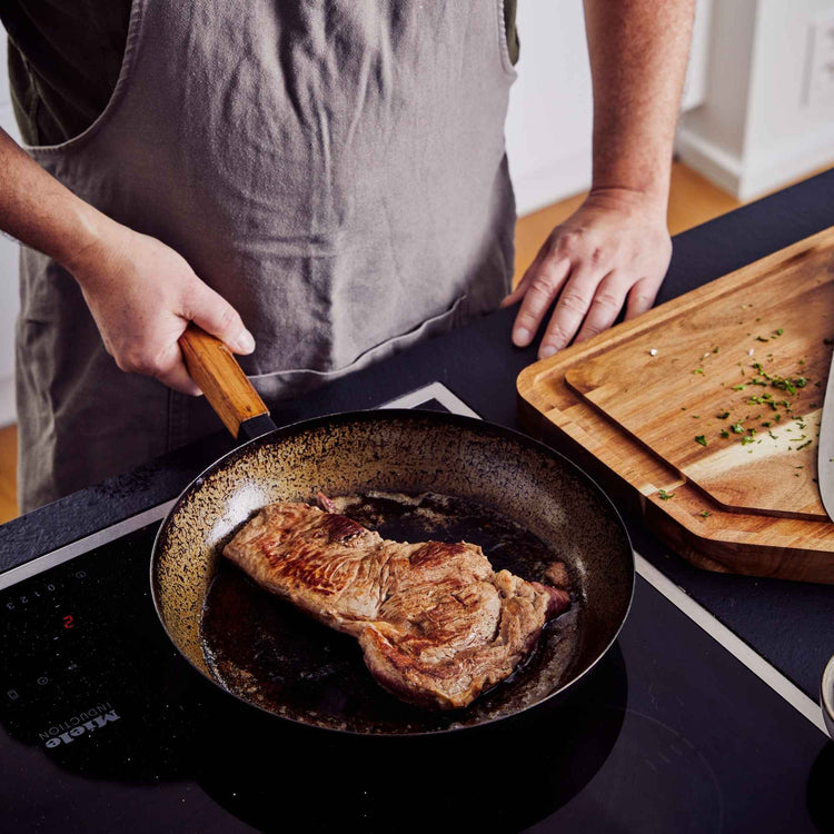 12-inch Alva Cookware wok pan from a 4-piece cookware set, featuring a black non-stick surface and stainless steel handle.
