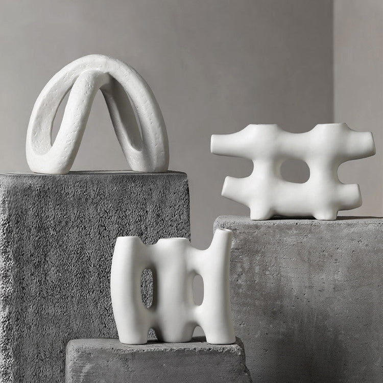 White ceramic vase by FLIPSTYLEZLLC, designed for creative flower arrangements and modern living room decor.