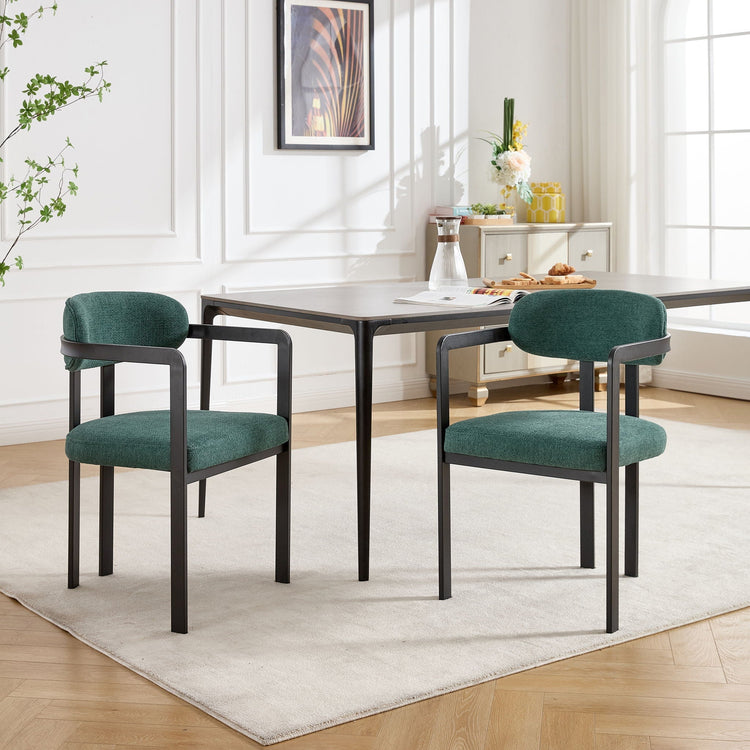 Set of two HouseOfZazla dining arm chairs with wooden legs and upholstered seats, shown in a modern kitchen setting.