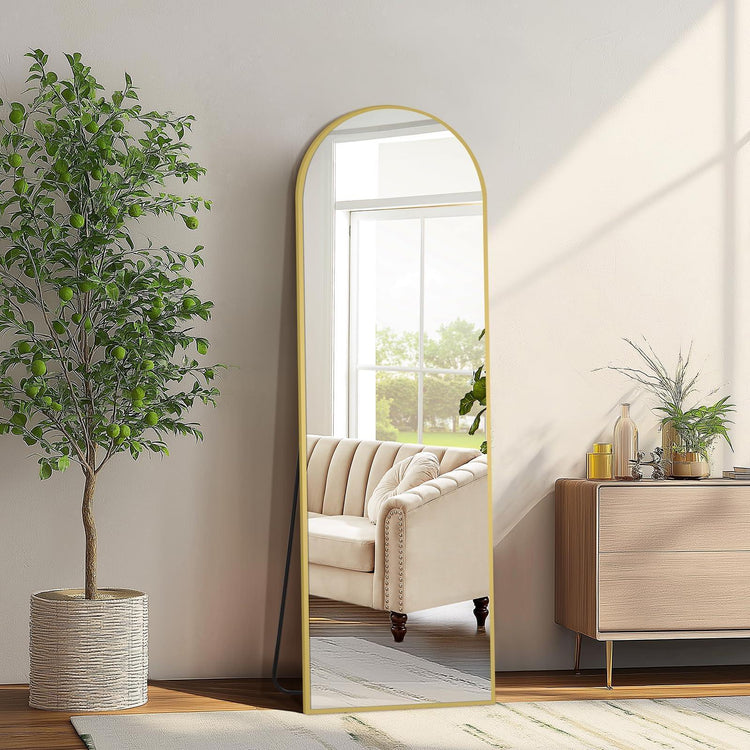 Oversized freestanding arched floor mirror with full-length design and gold aluminum frame by MIRRORONS.