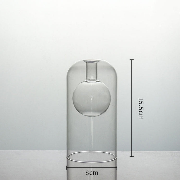 Clear glass vase by FLIPSTYLEZLLC with double container design, ideal for modern home decor, wedding decoration, or hydroponic plants.