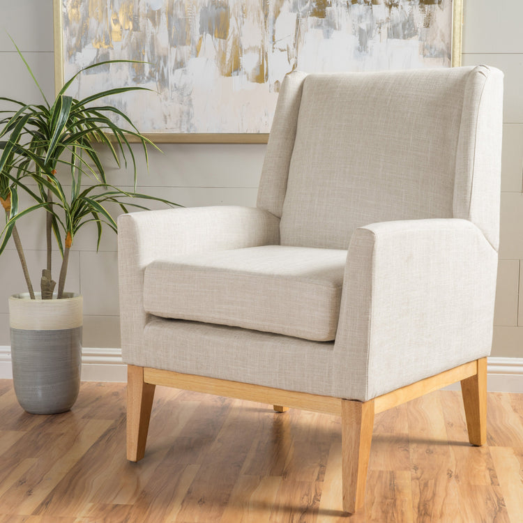 Beige mid-century modern accent chair with padded cushion seat for home or office, featuring sleek design and comfortable fabric upholstery.