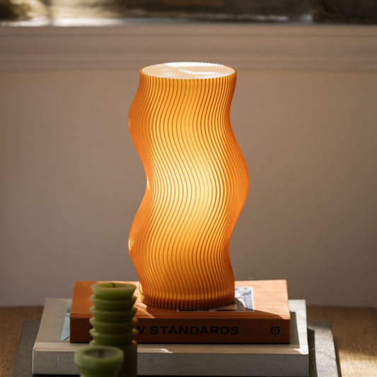 Terra Labs Woogie Table Lamp with a modern, rounded design and soft lighting, perfect for living room or bedside table decor.
