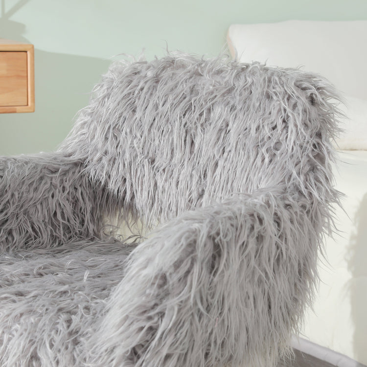 Grey faux fur upholstered dining chair with metal legs, showcasing a modern and plush design for stylish dining spaces.