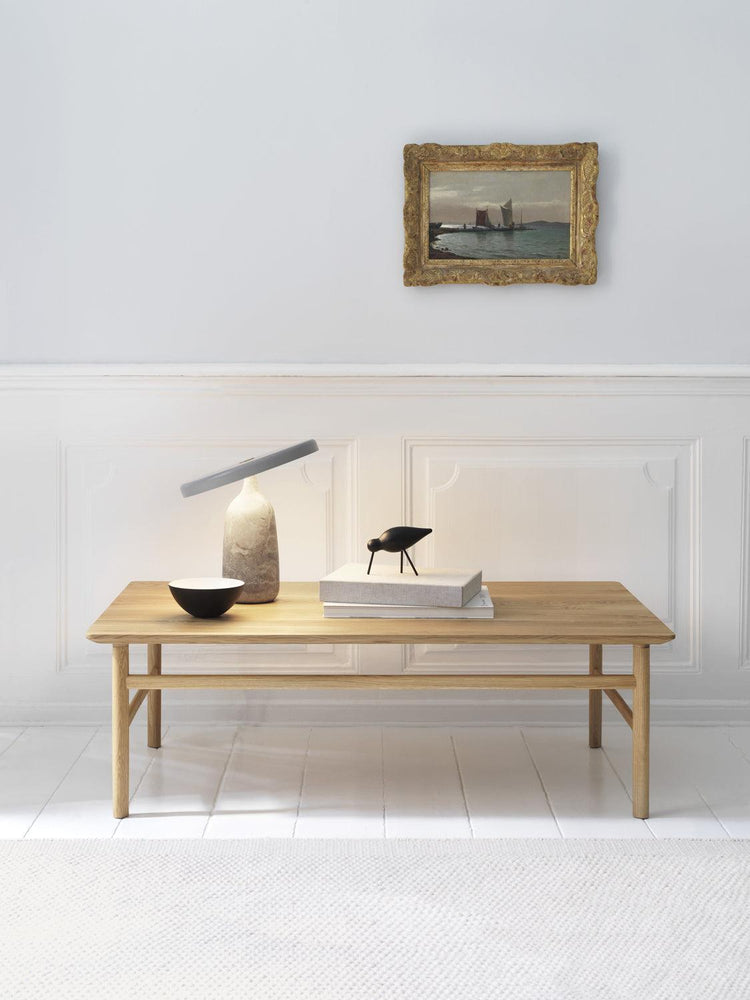 Mooiehome Eddy table lamp with a 12.6-inch ceramic base and fabric shade, modern design perfect for bedside or desk lighting.
