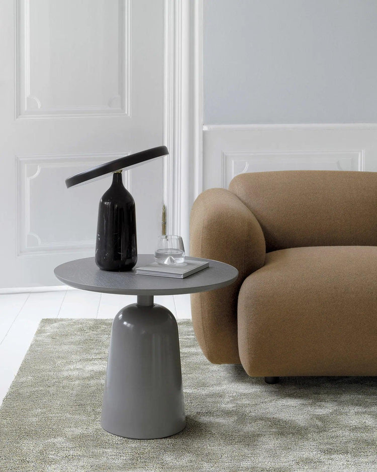 Mooiehome Eddy 12.6-inch table lamp with a sleek, modern design and a cylindrical shade on a sturdy base.