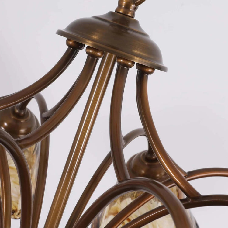 Elvarin chandelier by Mooiehome with elegant hanging glass and metal frame, designed to add a modern touch to dining or living rooms.