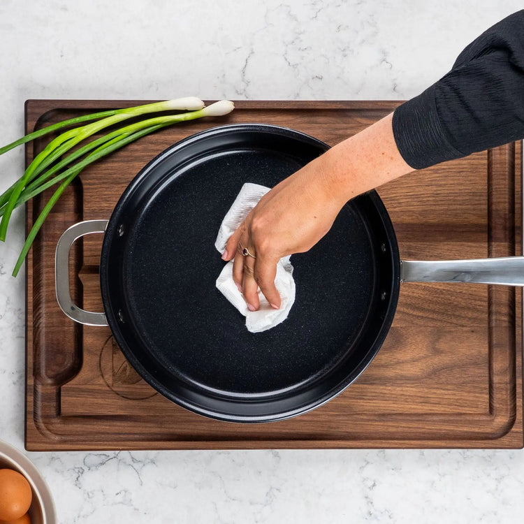 Alva Cookware frying pan with non-stick surface and stainless steel handle, shown from top view.