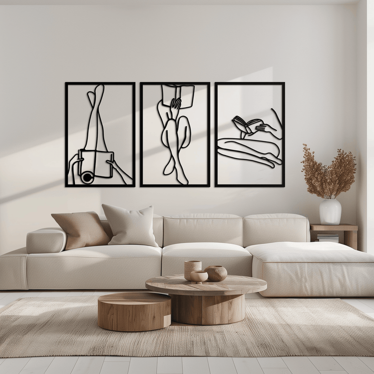 Modern metal wall art featuring a woman reading, by Enova Art, with sleek minimalist steel design for contemporary home decor.