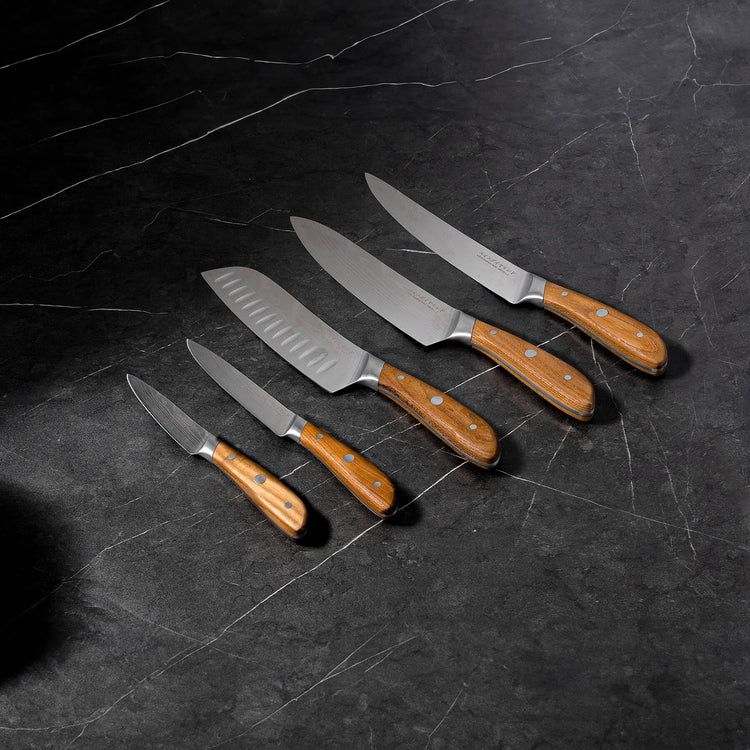 Swiss Diamond Damascus 5-piece knife set stacked, featuring stainless steel blades with Damascus pattern and ergonomic handles.