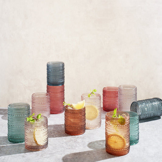 Set of 12 Khen Site highball and lowball glasses with hobnail texture, 14 oz and 11 oz, in muted tones, for elegant drinkware.