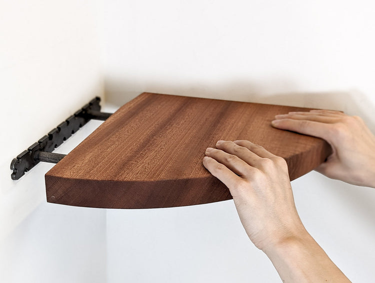 Handmade mahogany corner wall shelf by NookWoodworking, floating storage shelf for elegant home organization.