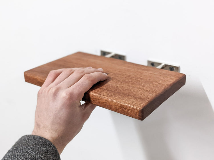Natural oak floating wall shelf by NookWoodworking, 6 to 36 inches, showcasing a minimalist design for stylish wall storage.