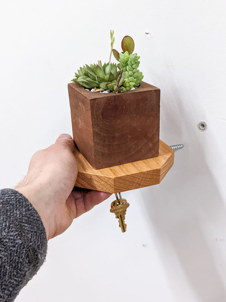 Wooden octagon key hook shelf by NookWoodworking mounted on an entryway wall, showcasing natural oak finish and practical hooks.
