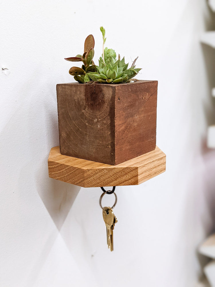 Wooden octagon key hook shelf from NookWoodworking, oak entryway wall shelf with hooks for keys and small items.