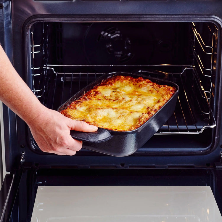 Alva Cookware 12x8-inch roasting pan, a sturdy casserole dish with handles, ideal for roasting and baking in the kitchen.