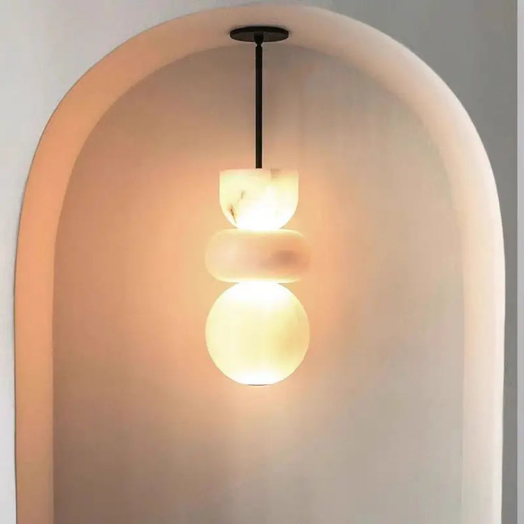 Decorbités alabaster pendant light ceiling chandelier with a sleek, modern design and elegant alabaster shade.