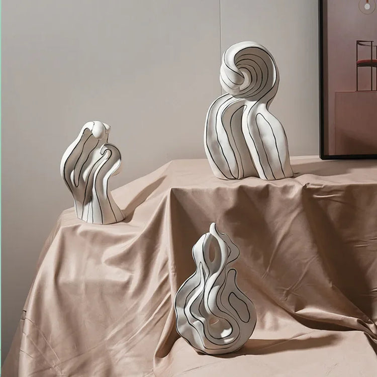 Modern ceramic curl sculpture decor by Decorbites, featuring sleek porcelain art accent with smooth, flowing curves.