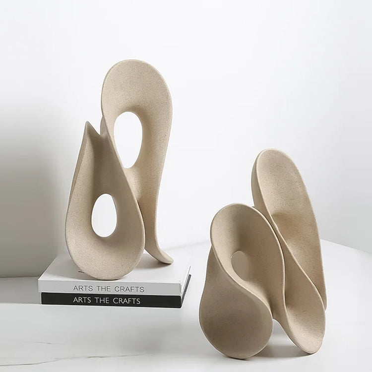 Coral hollow resin sculpture of an abstract human figure, modern home decor accent piece by Decorbites, detailed and artistic.