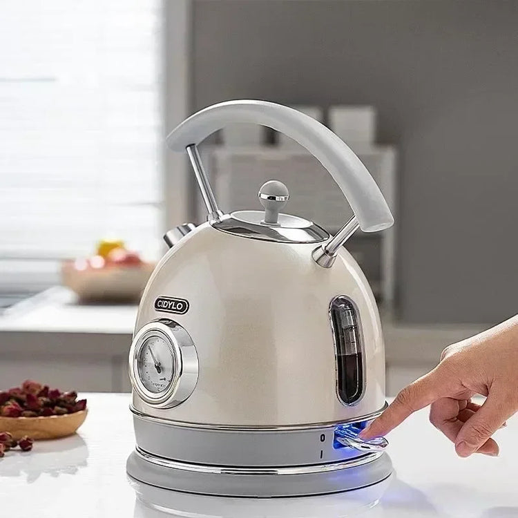 SmartPursue™ electric kettle with built-in thermometer, stainless steel body, and ergonomic handle for precise boiling temperature control.