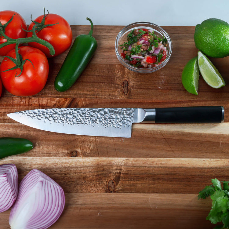 Swiss Diamond 8-inch hammered chef knife with stainless steel blade and ergonomic handle, ideal for precise kitchen cutting tasks.