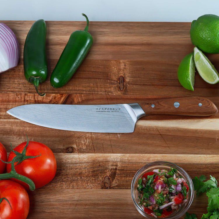 8-inch Damascus chef knife by Swiss Diamond with a sharp, layered steel blade and ergonomic handle for precise cutting.