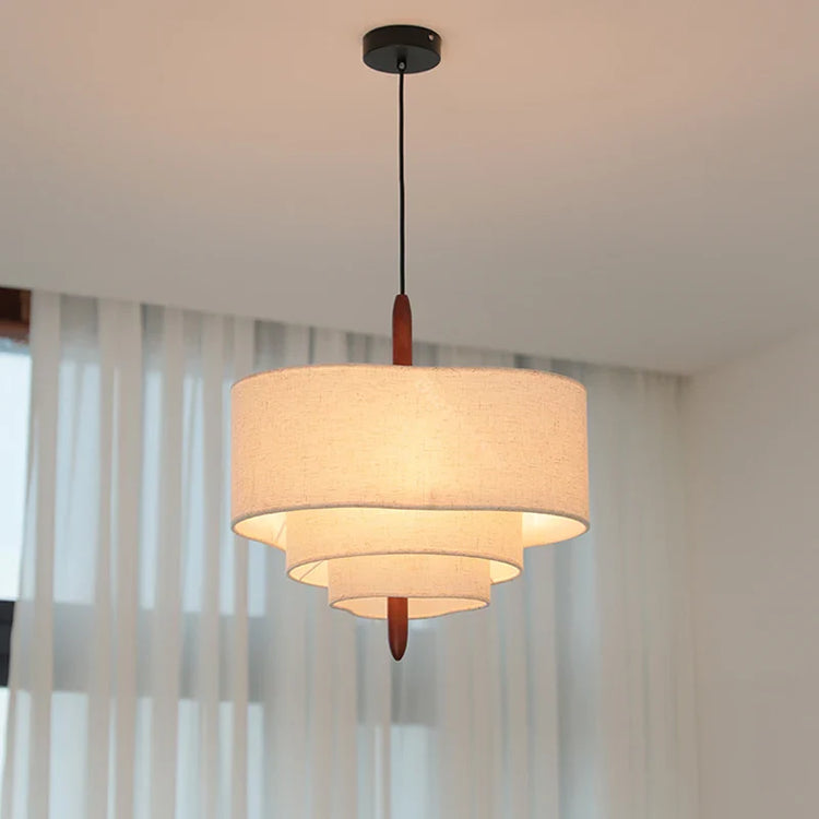 Fabric chandelier light fixture by DECORBITES with a soft, elegant fabric shade and intricate hanging design for warm ambient lighting.