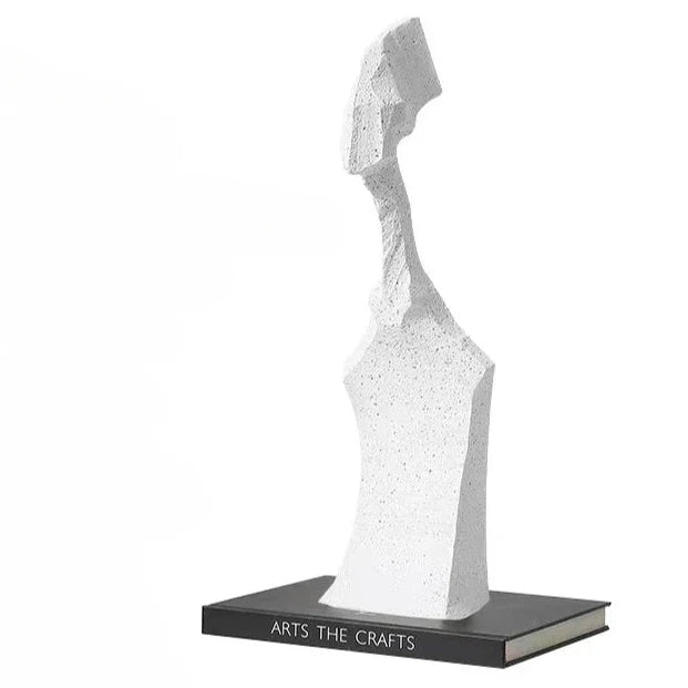 Modern resin sculpture featuring abstract character designs, decorative accent piece for contemporary interior decor.
