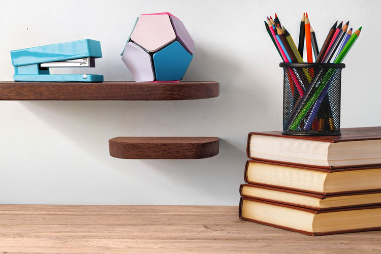 Thin curved mahogany floating shelf by NookWoodworking, wall-mounted with rounded edges, ideal for stylish storage or display.