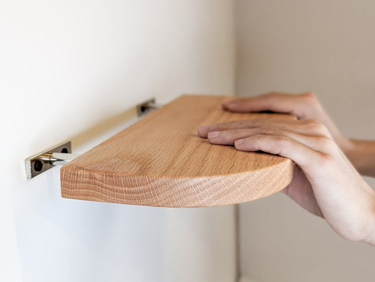 Thin wooden floating shelf with rounded edges, 6-36 inches, made of mahogany by NookWoodworking, mounted on a wall.