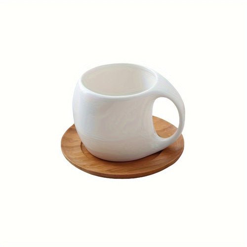 White mug with wooden coaster on a white background