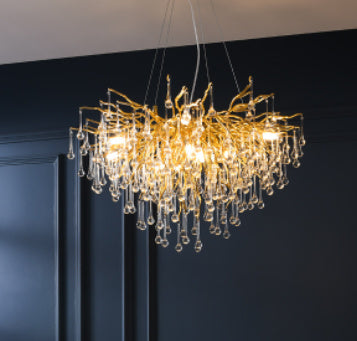 Decorbites Postmodern Light Luxury Chandelier with water drop crystal design hanging in a modern interior setting