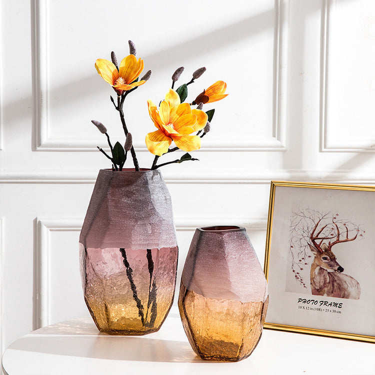 Set of three handmade blown glass vases with geometric faceted shapes and ombre purple amber finish, perfect for home decor.