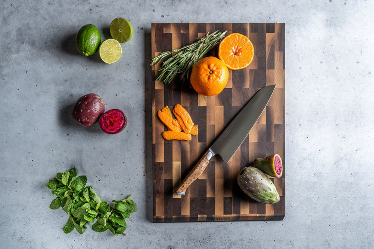 Steelport Knife Co. Everyday Knife and Board Set featuring a sleek kitchen knife and wooden cutting board for versatile food prep.
