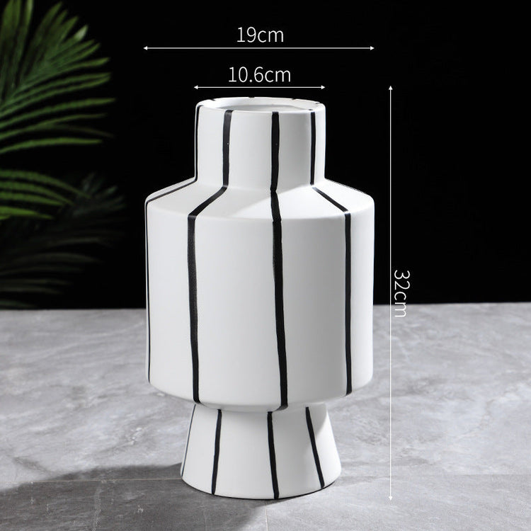 Black and white striped ceramic vase with a modern, light luxury design, perfect for contemporary home decor by FLIPSTYLEZLLC