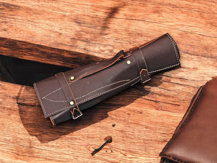 Handmade Damascus kitchen knives set with bone and rosewood handles, showcasing sharp blades and elegant craftsmanship.