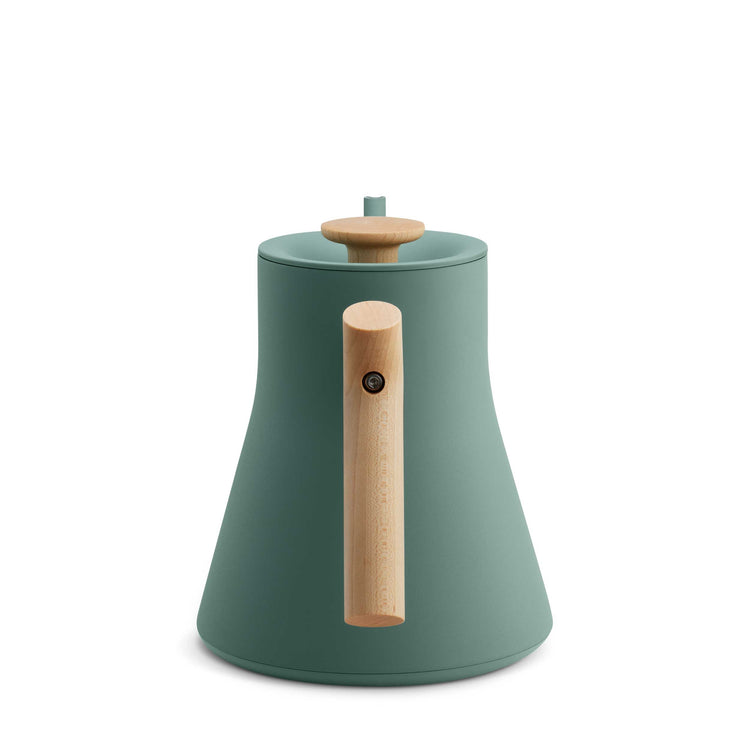 Fellow Stagg EKG Pro electric kettle in smoke green with maple handle, showcasing sleek design and digital controls.