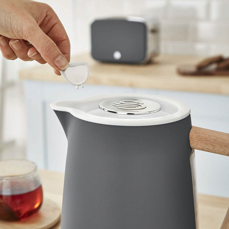Swan Nordic 1.7L cordless stainless steel kettle with 1500W rapid boil and wood-effect handle, ideal for modern kitchens.