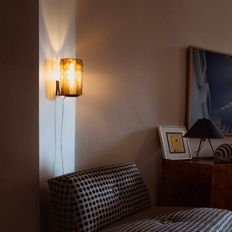 Wooj Design Gem Sconce featuring a modern, geometric glass fixture with sleek metal accents for stylish wall lighting.