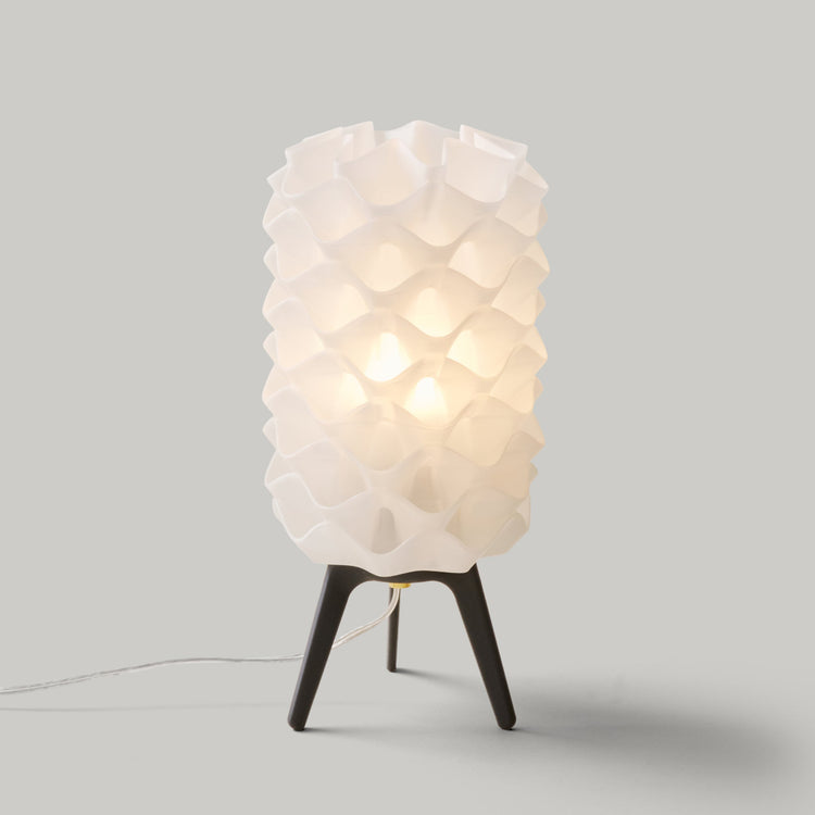 Matte black Lotus Lamp by Wooj Design, contemporary designer lighting, featuring a sleek, sculptural lamp with floral-inspired design.