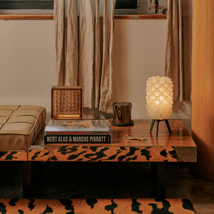 Matte black Lotus lamp by Wooj Design, contemporary designer lighting with a sleek, sculptural lamp shape for modern interiors.