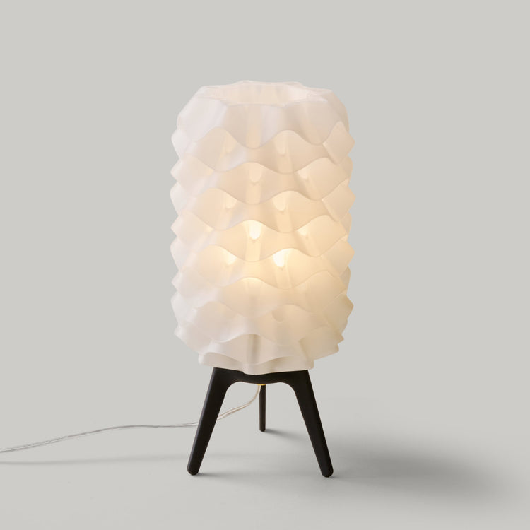 Matte black Lotus lamp by Wooj Design, contemporary designer lighting with a sleek, modern aesthetic and unique floral-inspired shape.