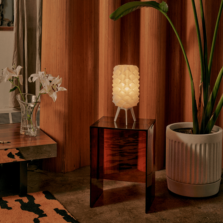 Matte black Lotus lamp by Wooj Design, contemporary designer lighting with floral-inspired shape and sleek modern style.