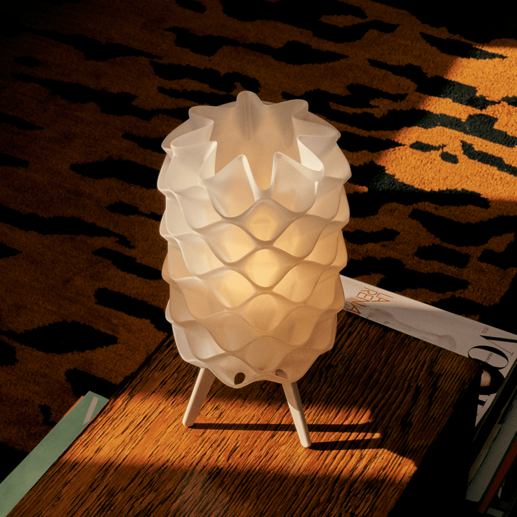 Matte black Lotus Lamp by Wooj Design, contemporary designer lighting with a sleek, floral-inspired lamp shape.